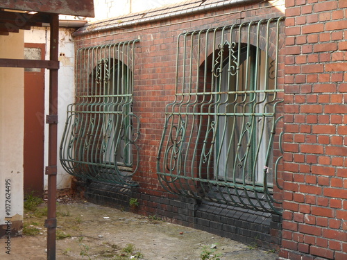 Curved metal grates in a brick building