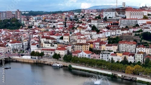 4K drone video footage of Coimbra city old town and university. Panoramic aerial cityscape of Coimbra university and Mondego River, Portugal