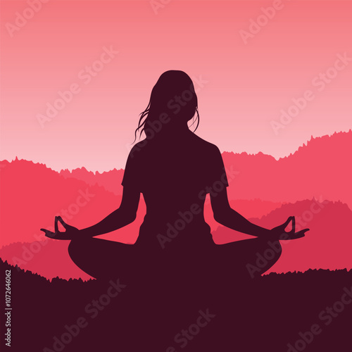 Silhouette of a woman meditating in the mountains