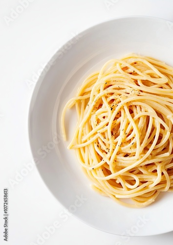 Spaghetti with parmesan and parsley palted on a white plate on a white background.