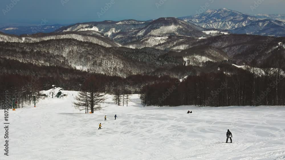 Skiers and snowboarders at Madarao, Japan