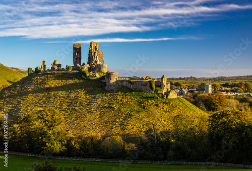 Aerial sunset view of Corfe Castle, a village and civil parish in the English county of Dorset photo