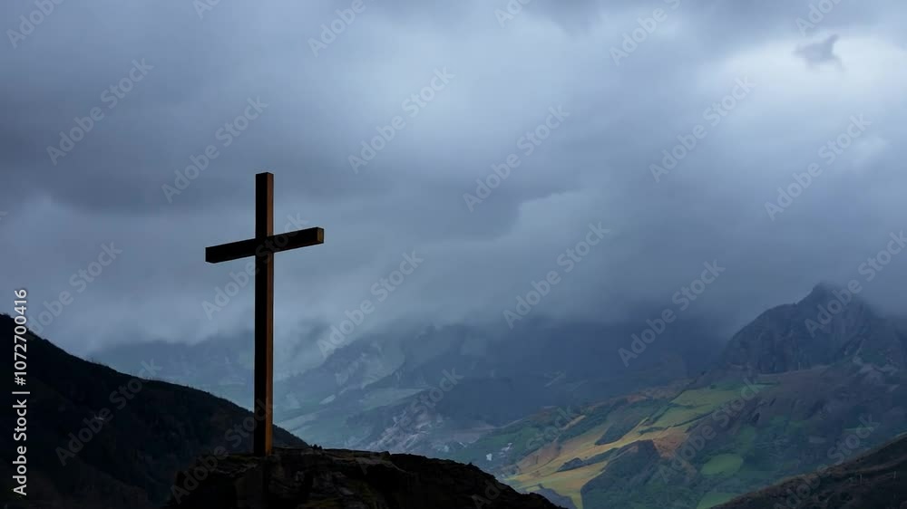 Storm approaching mountain peak with cross Storm approaching mountain peak with cross
