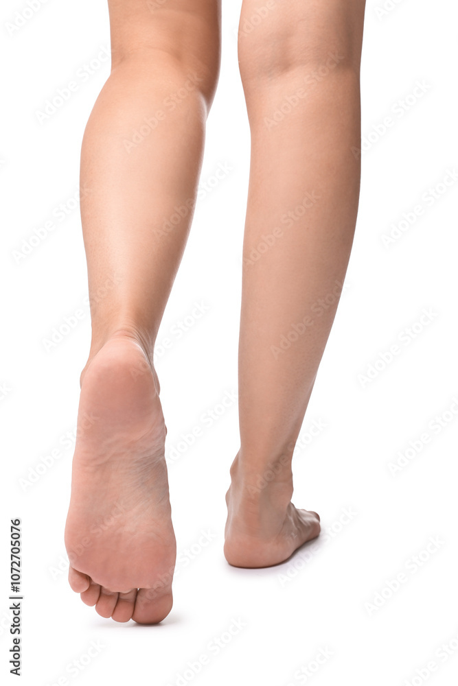 Barefoot woman on white background, closeup view Barefoot woman on white background, closeup view