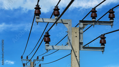 Cement High voltage Electric pole blue sky background. photo