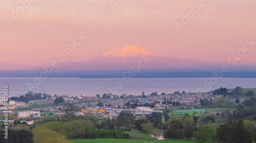 Aerial view of Llanquihue city with Osorno volcano and Llanquihue lake on sunset