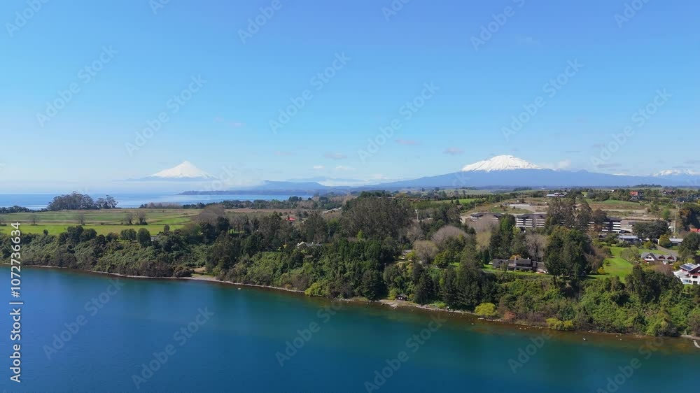 Aerial view of coast of Llanquihue lake with Osorno and Calbuco volcanoes in Puerto Varas Aerial view of coast of Llanquihue lake with Osorno and Calbuco volcanoes in Puerto Varas
