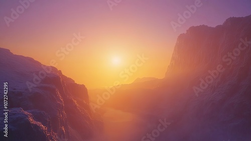 A vibrant orange sunset casts a warm glow over a snow-covered mountain valley.