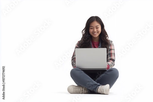 Happy young Asian female college student sitting isolated at white background using laptop computer advertising elearning course, online education webinars, internet services.