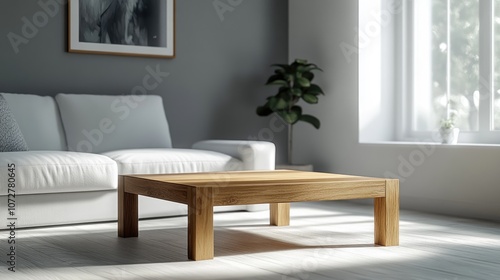 A realistic photo of a chic, bright living room showcasing a wooden square coffee table near a white sofa. The grey wall with an art poster adds a modern touch to the minimalist design. Shot in