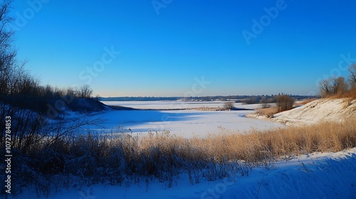 A Frozen River Valley Under a Clear Blue Sky