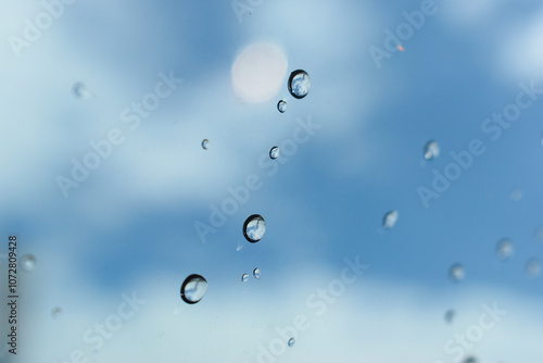 Wallpaper Mural water drop on mirror with blue sky and white cloud background Torontodigital.ca