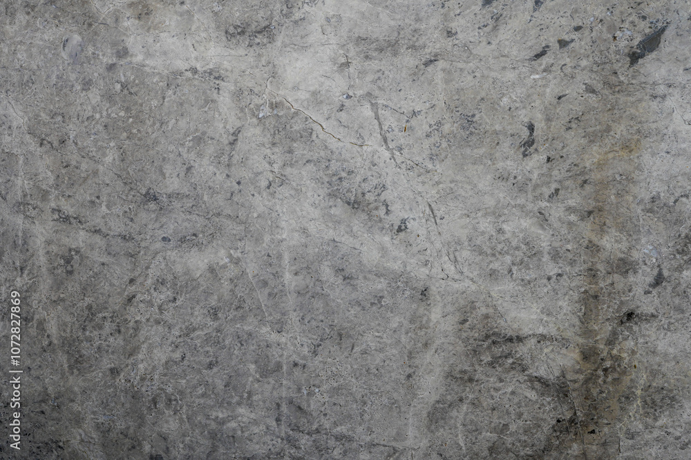 Fototapeta premium Textured Gray Marble Background with Subtle Veins and Variations, Ideal for Elegant Design Projects, Home Decor or Fashion Applications