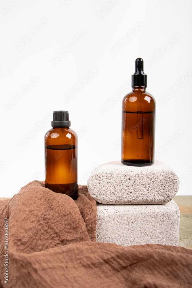 Matte Black Dropper Bottles on Stone Blocks with Natural Wooden Accents