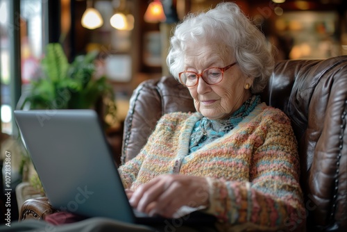 Active and Tech-Savvy Older Woman Using Laptop in Cozy Setting, Challenging Traditional Stereotypes of Aging and Showcasing Lifelong Learning for Connection and Mental Stimulation