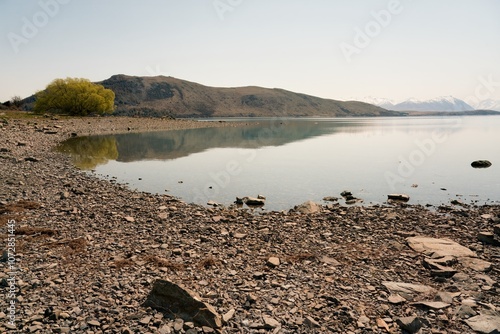 Rocky Shoreline of Lake Tekapo: Scenic New Zealand Landscape photo