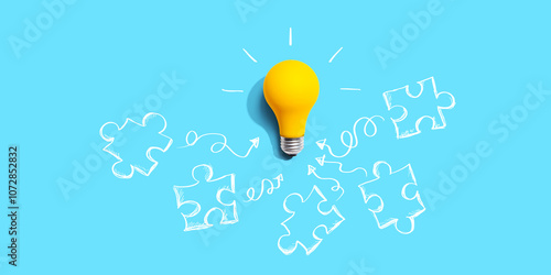 Jigsaw puzzle with a yellow light bulb - flat lay
