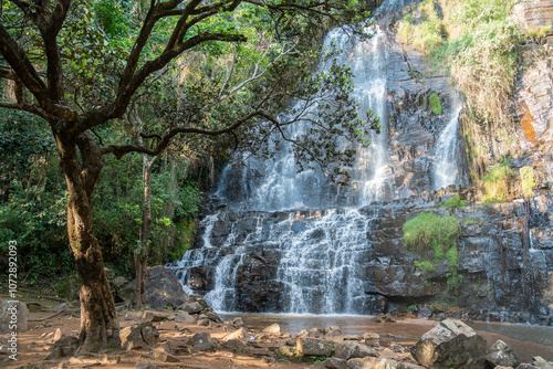 Waterfall among trees and rocks in a forest, Chutes de la Karera Falls, Burundi