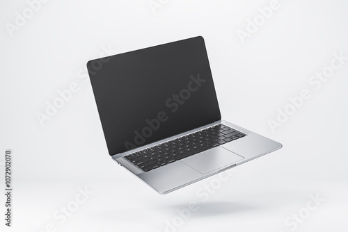 Bild auf Leinwand Close up of modern laptop with blank black screen with copyspace for your text or logo on abstract light background