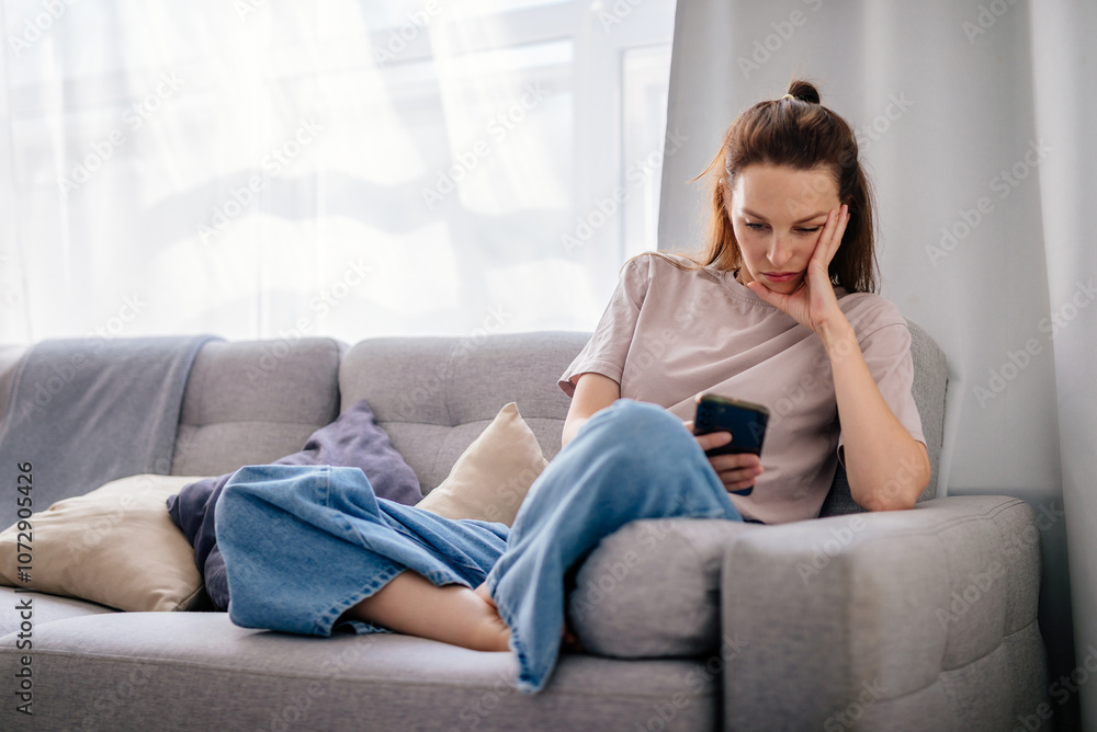 Female using smartphone at home internet watching videos, social networks Female using smartphone at home internet watching videos, social networks