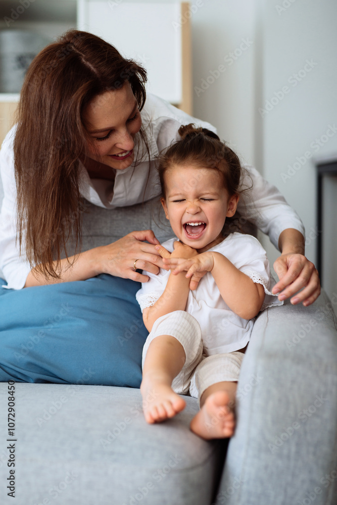 Mother and laughing daughter at home Mother and laughing daughter at home