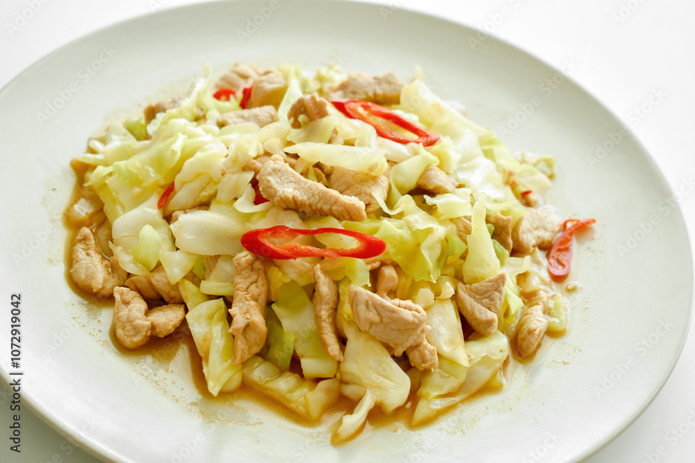 Stir fry cabbage with pork, garlic and red chillies. Asian food. Healthy and dietary meal. Spicy dish.
Stir fry cabbage with pork, garlic and red chillies. Asian food. Healthy and dietary meal. Spicy dish.