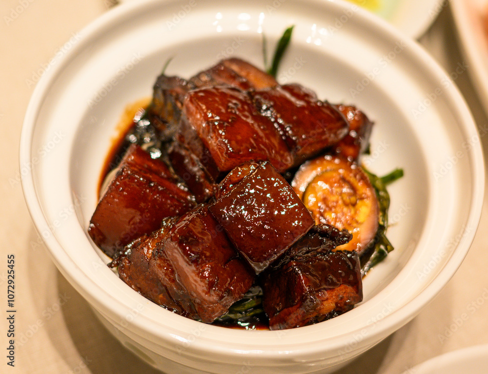 Mouth watering braised pork belly (Hong Shao Rou in Chinese) in a pot.