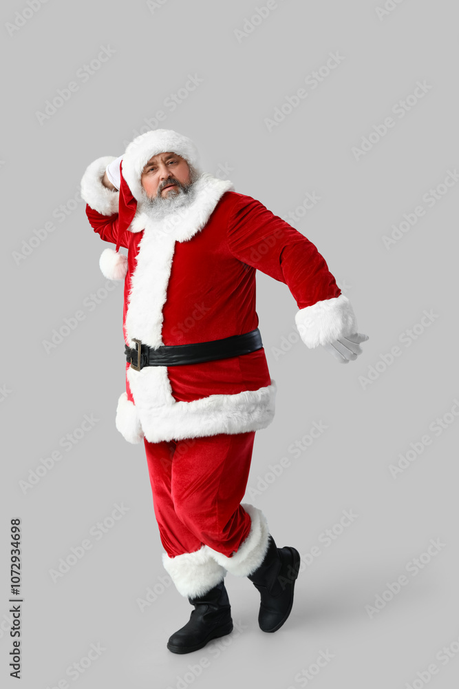 Dancing Santa Claus on grey background Dancing Santa Claus on grey background
