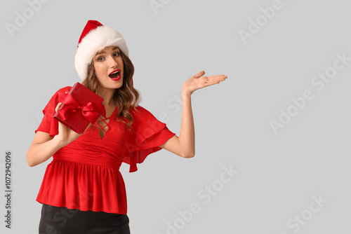 Excited young woman in sant...