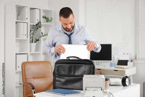 Young businessman putting l...