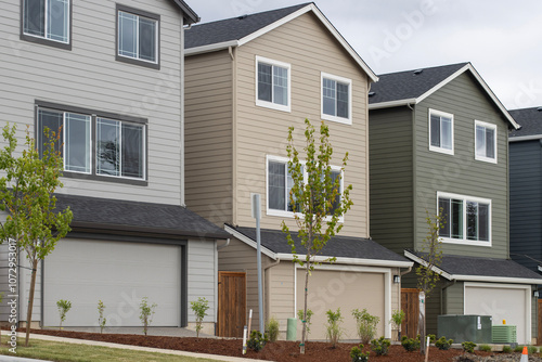 New single-family houses built on small lots in a large suburban residential community.