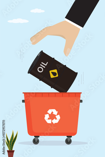 Businessman hand throws oil barrel into trash can. Oil crisis, overproduction, recession leads to decrease in consumption. Lower prices for commodities. Alternative energy.