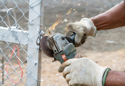 The technician is using construction tools to grind the steel to make the surface smooth and free of roughness.
