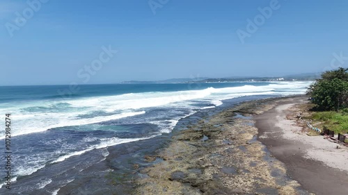 Aerial drone long telephoto shot of a ocean tides in La union