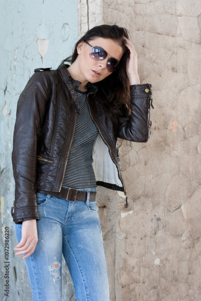Portrait of a young woman walking on the streets. Portrait of a young woman walking on the streets.