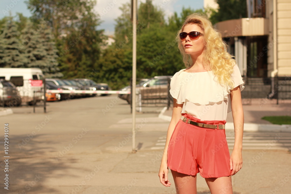 Portrait of a young woman walking on the streets. Portrait of a young woman walking on the streets.