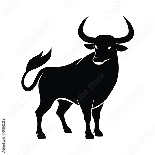 a angry bull. The bull is standing on all fours and is facing towards silhouette