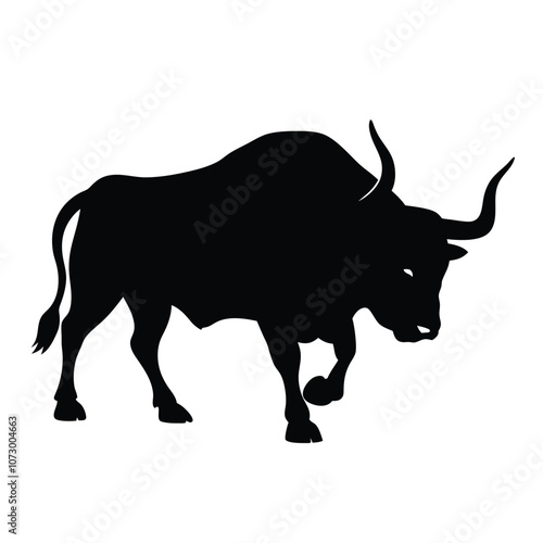 a angry bull. The bull is standing on all fours and is facing towards silhouette
