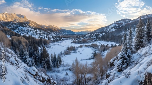 96. Wide-angle shot of a snow-blanketed valley with blue shadows from the setting sun