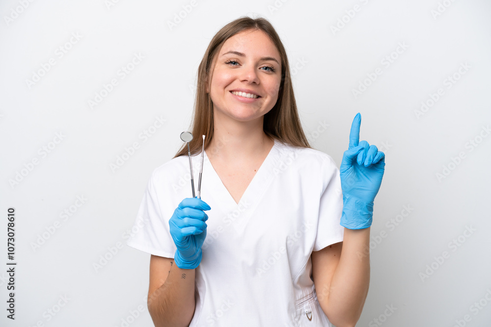 Dentist woman holding tools isolated on white background showing and lifting a finger in sign of the best Dentist woman holding tools isolated on white background showing and lifting a finger in sign of the best