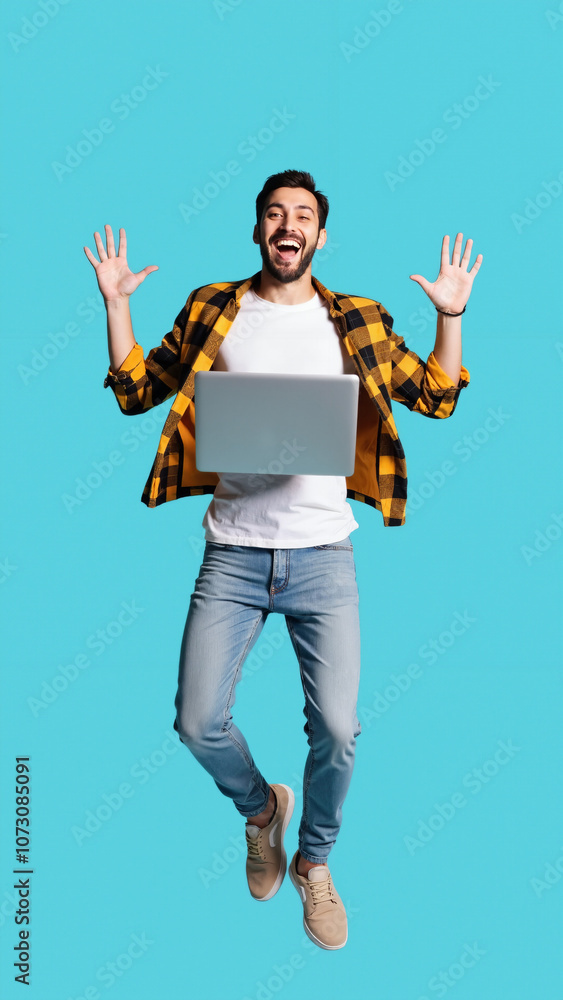 Ecstatic Young Man Leaping with Laptop: Tech Success, Online Achievement, or Digital Celebration Ecstatic Young Man Leaping with Laptop: Tech Success, Online Achievement, or Digital Celebration