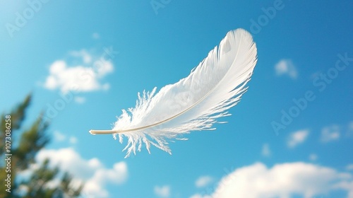 White Feather in Flight Against a Clear Blue Sky