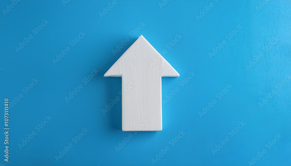 White wooden arrow on blue background. Business and market growth concept. White wooden arrow on blue background. Business and market growth concept.