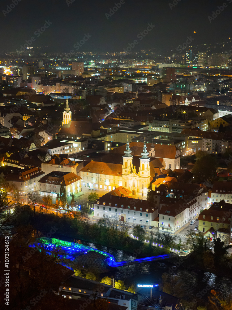 Obraz premium High Angle View Of Illuminated Cityscape Against Sky At Night, Graz, Austria