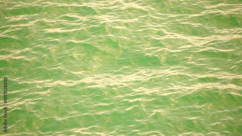 Sea water surface. Camera flies over the calm azure sea. Nobody. Holiday recreation concept. Abstract nautical summer ocean nature. Weather and climate change. Slow motion. Close up Sea water surface. Camera flies over the calm azure sea. Nobody. Holiday recreation concept. Abstract nautical summer ocean nature. Weather and climate change. Slow motion. Close up
