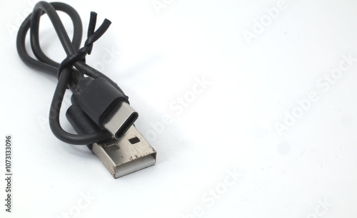 Close-up of USB cable with Type-A and Type-C connectors, arranged on white background. photo