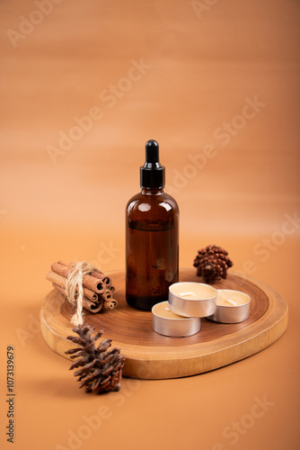 Wallpaper Mural Amber Dropper Bottle with Cinnamon Sticks and Tealight Candles on Wooden Tray for Aromatherapy and Skincare Torontodigital.ca