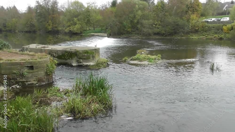 river Sarre with a cascade at a mill channel river Sarre with a cascade at a mill channel