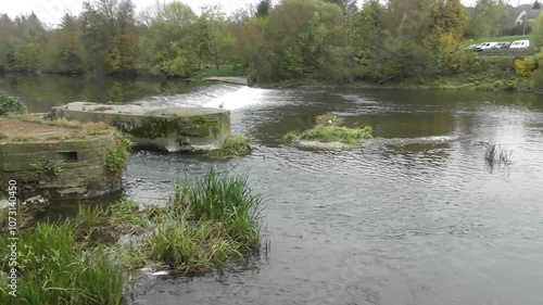 river Sarre with a cascade at a mill channel photo