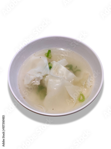 Boiled dumplings soup served in a small white bowl isolated on a white background